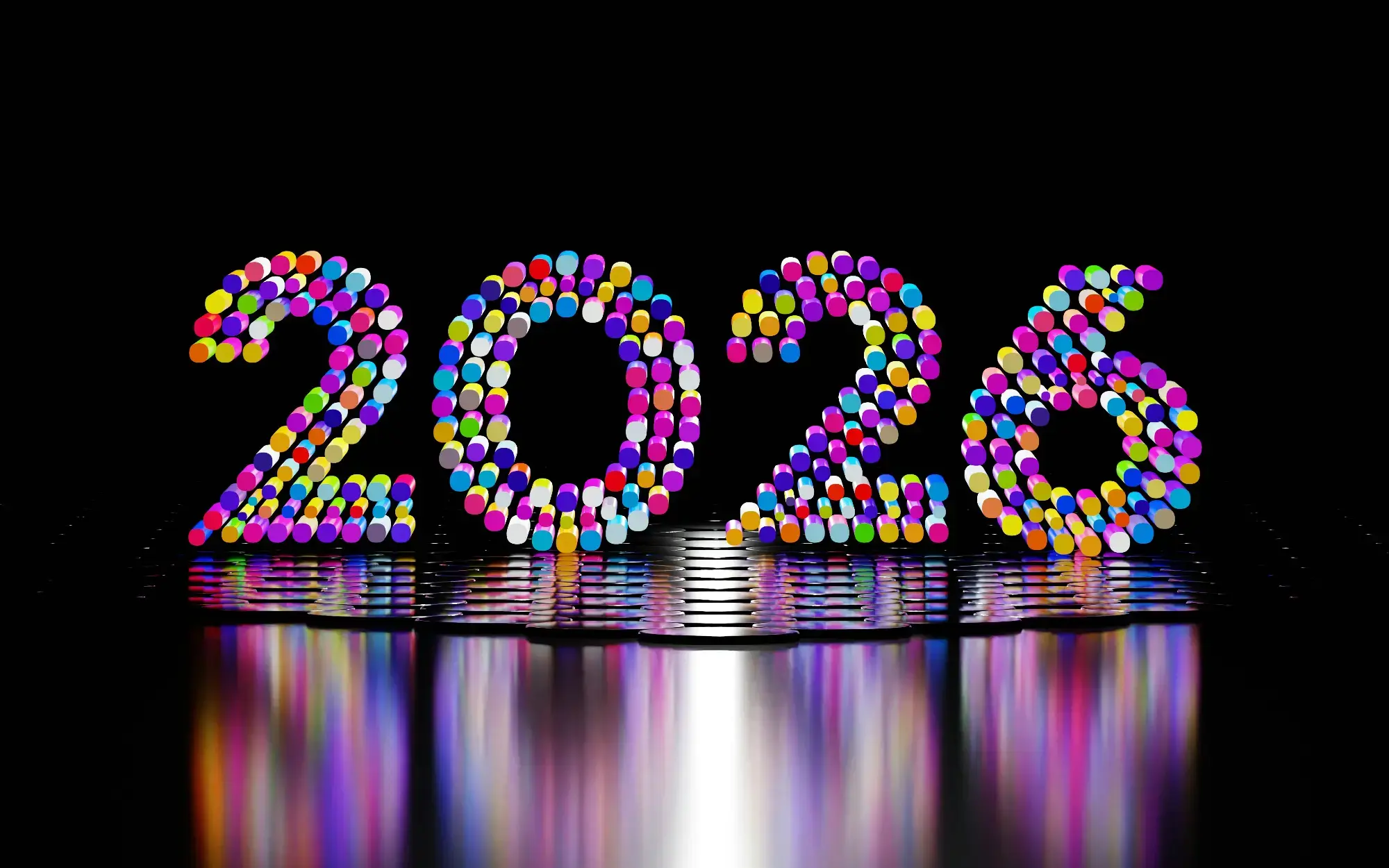 The number 2026 rendered in colorful lights on a reflective surface