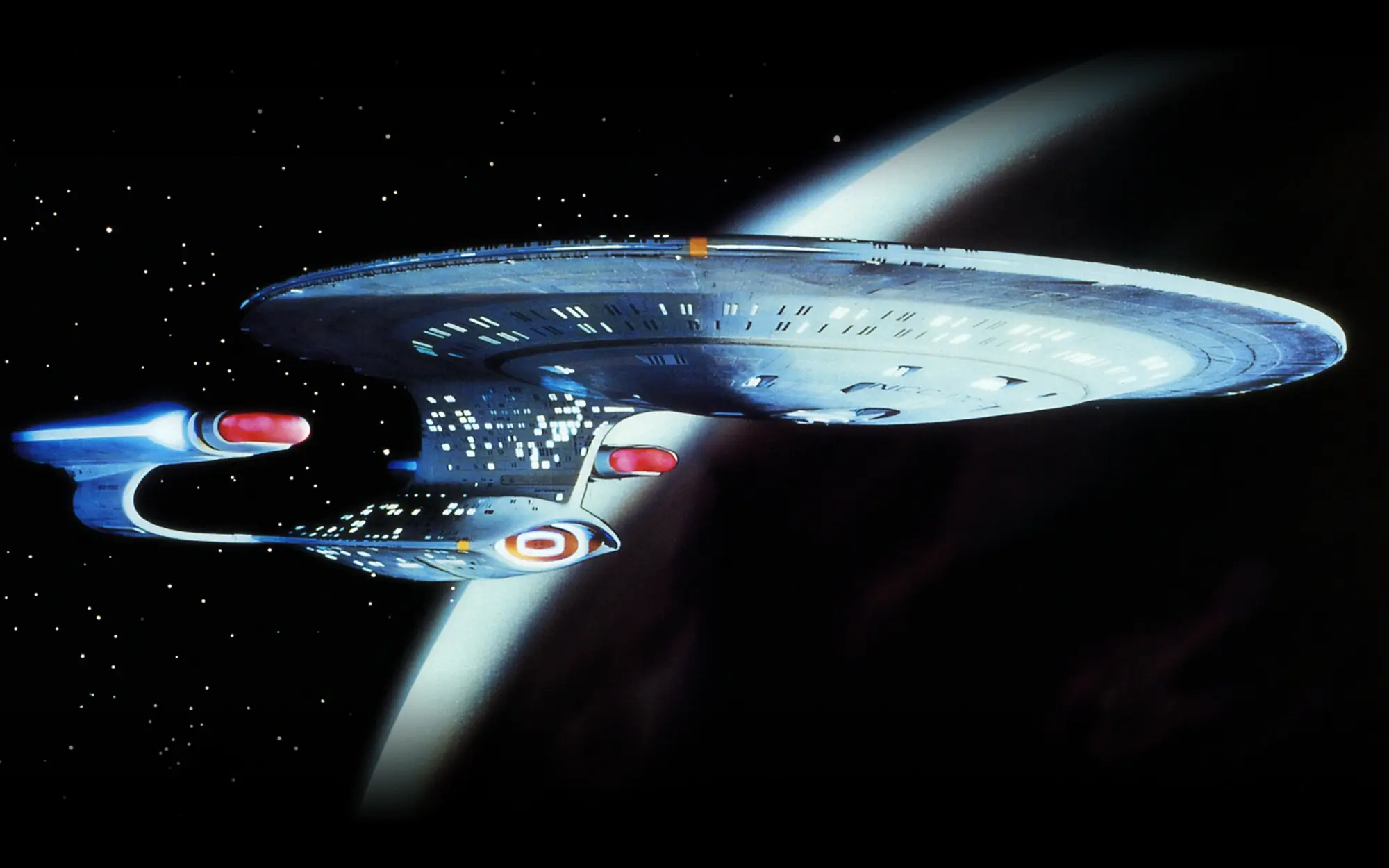 The U.S.S. Enterprise (NCC-1701-D) orbits a planet