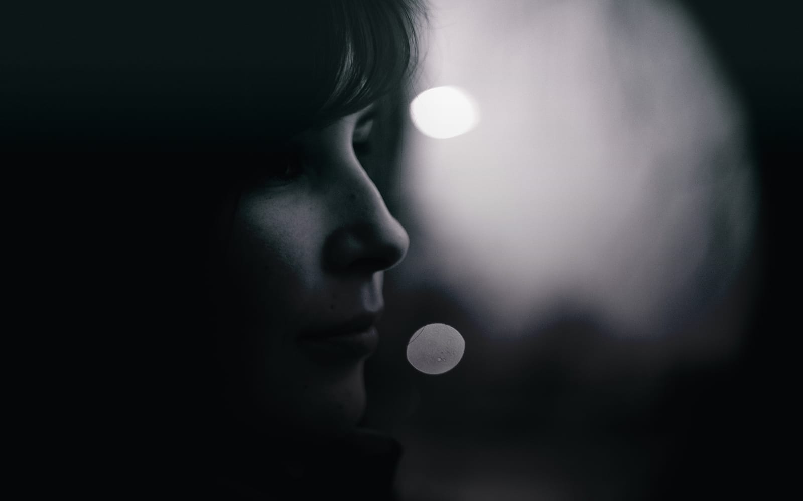 Shadowy profile of a woman's face