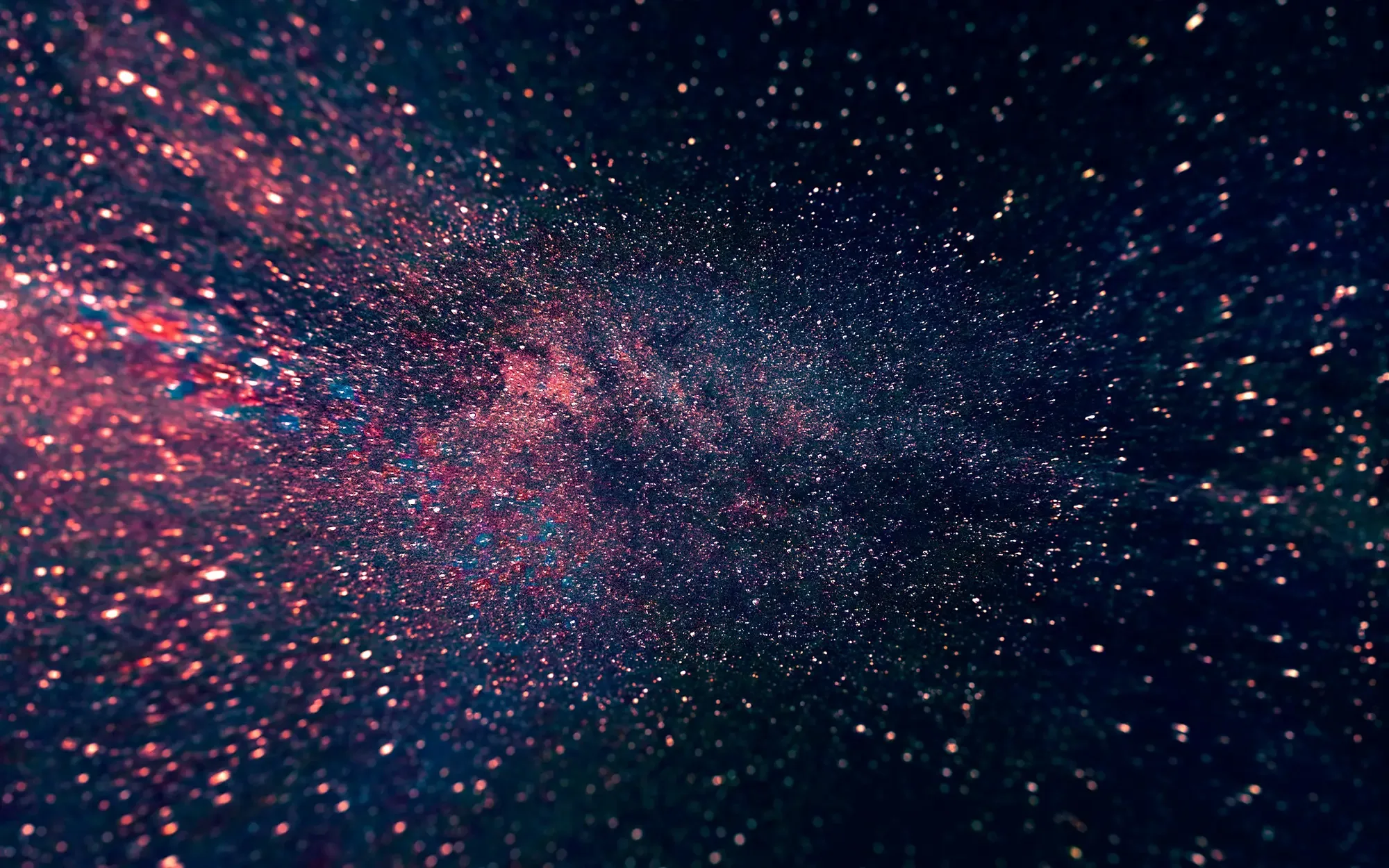 An abstract image of blue and red stars splashed across the night sky